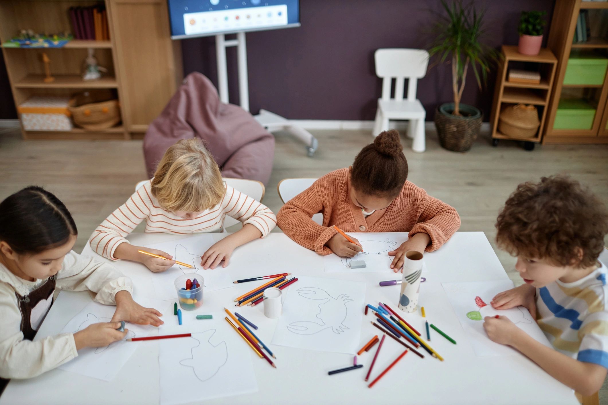Children doing arts and crafts at a table