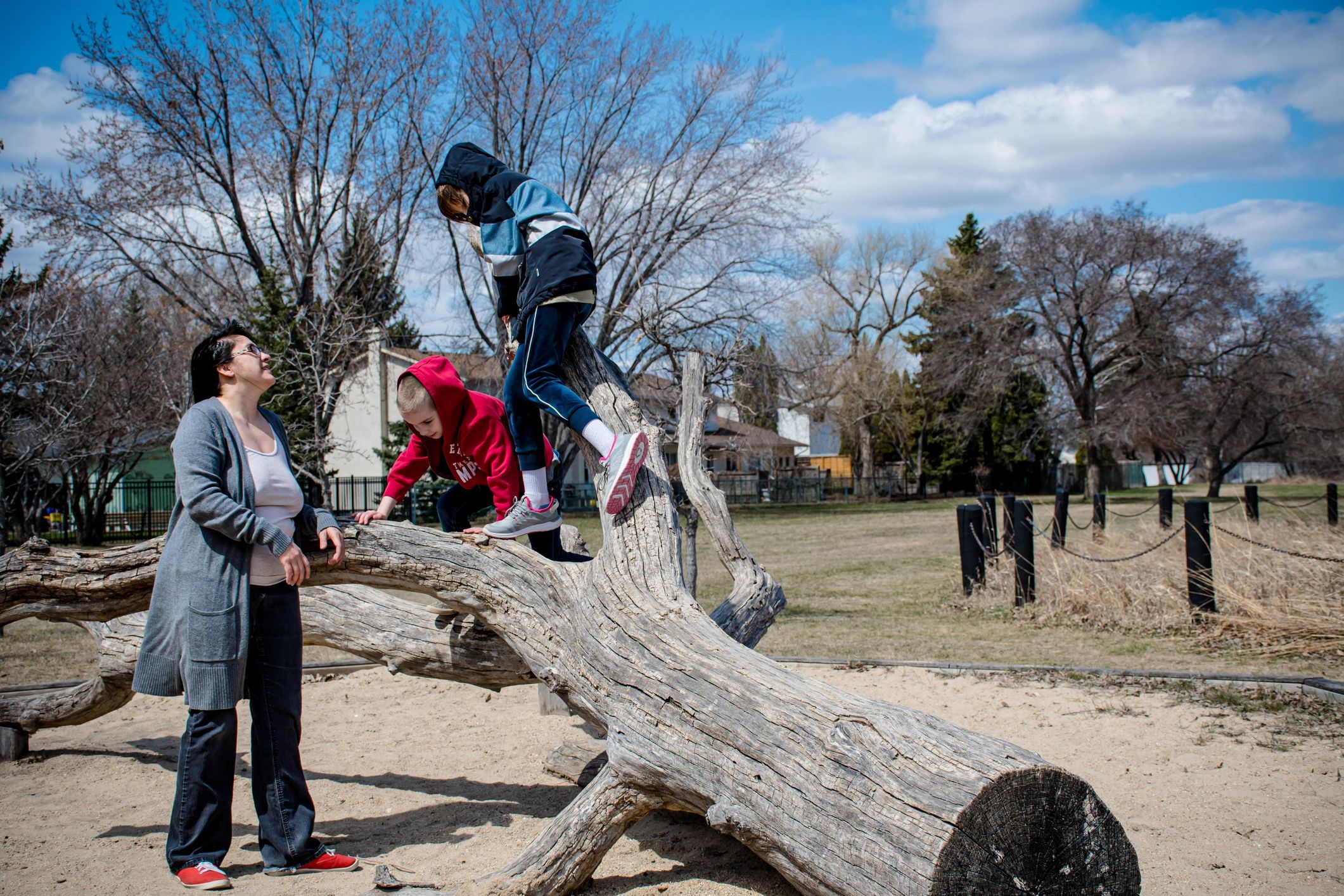 Parent and children playing together outdoors