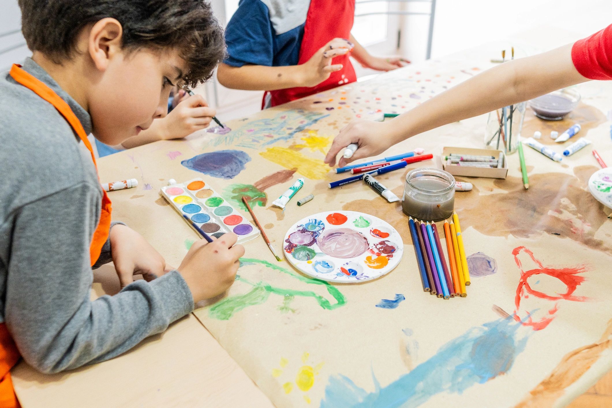 Child painting during an arts and crafts activity