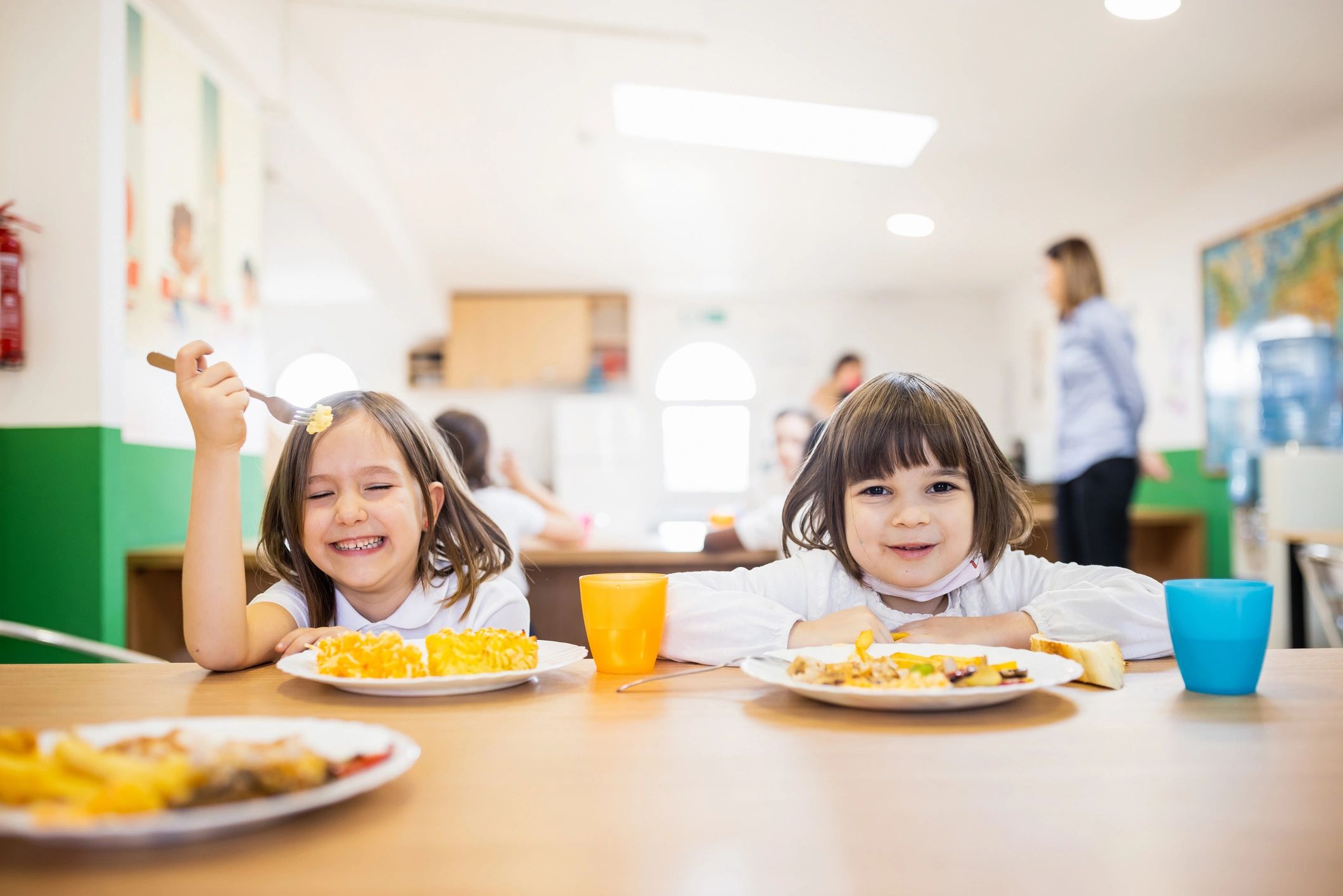 Child smiling during school lunch