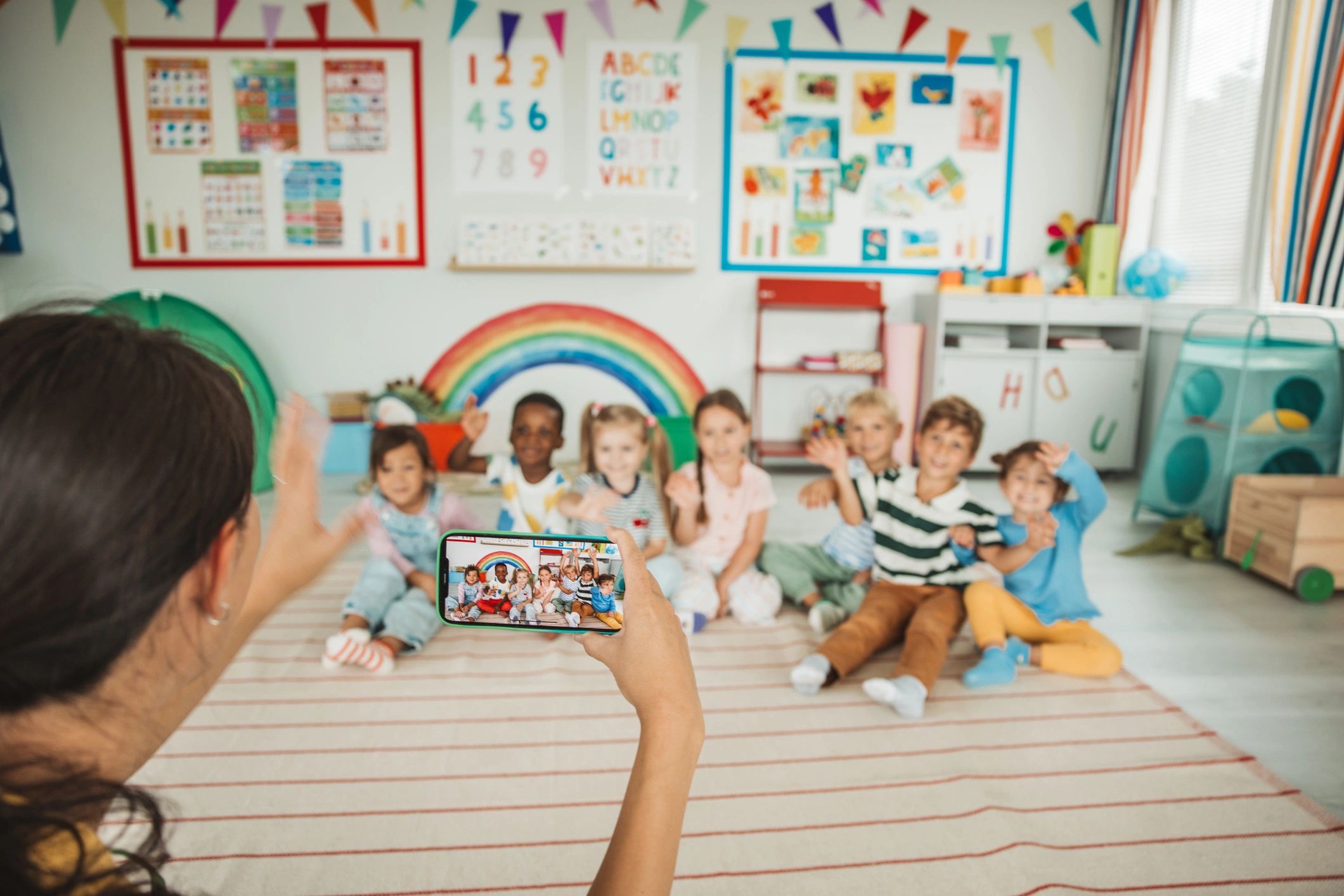 Children learning and playing in a bright preschool classroom