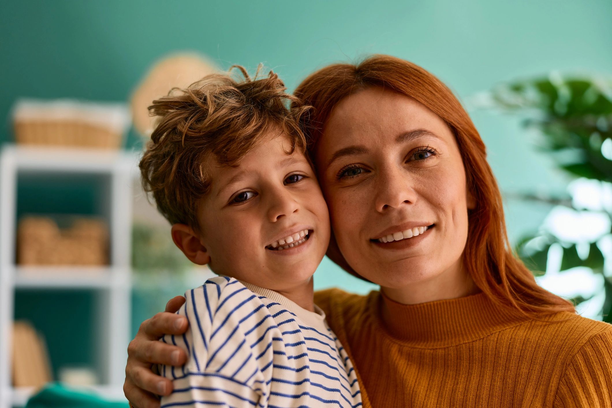 Parent and child sharing a warm hug, representing a supportive family experience